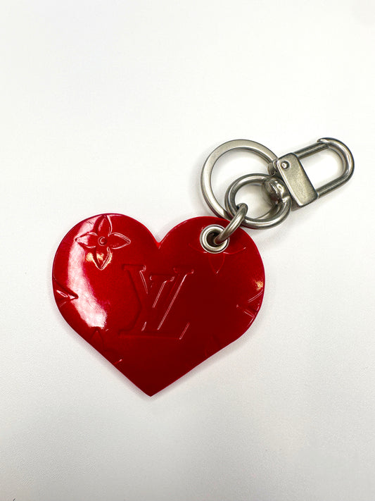 Lv red patent leather heart bag charm with large brass clasp
